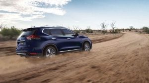 X-TRAIL driving on dusty road