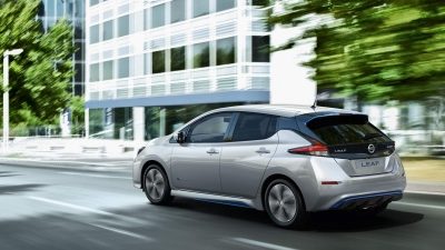 Nissan LEAF passing office building