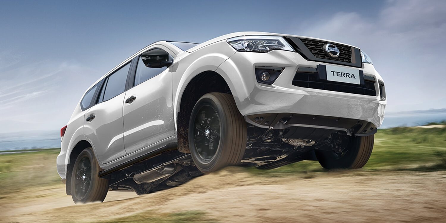 Nissan Terra driving up a rough dirt road