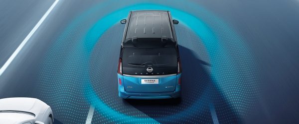 Nissan LEAF in city with driving sensor graphics