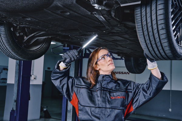 A women repairing a car