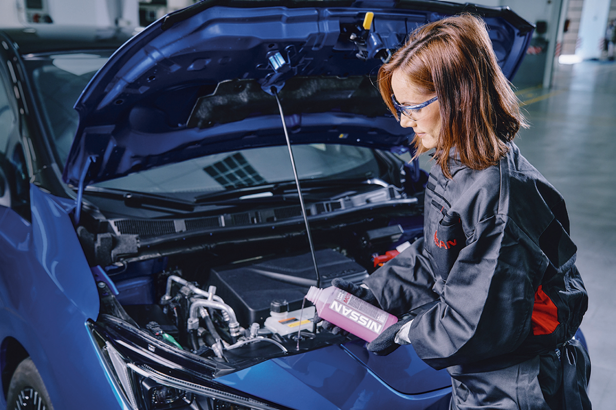 A women repairing a car