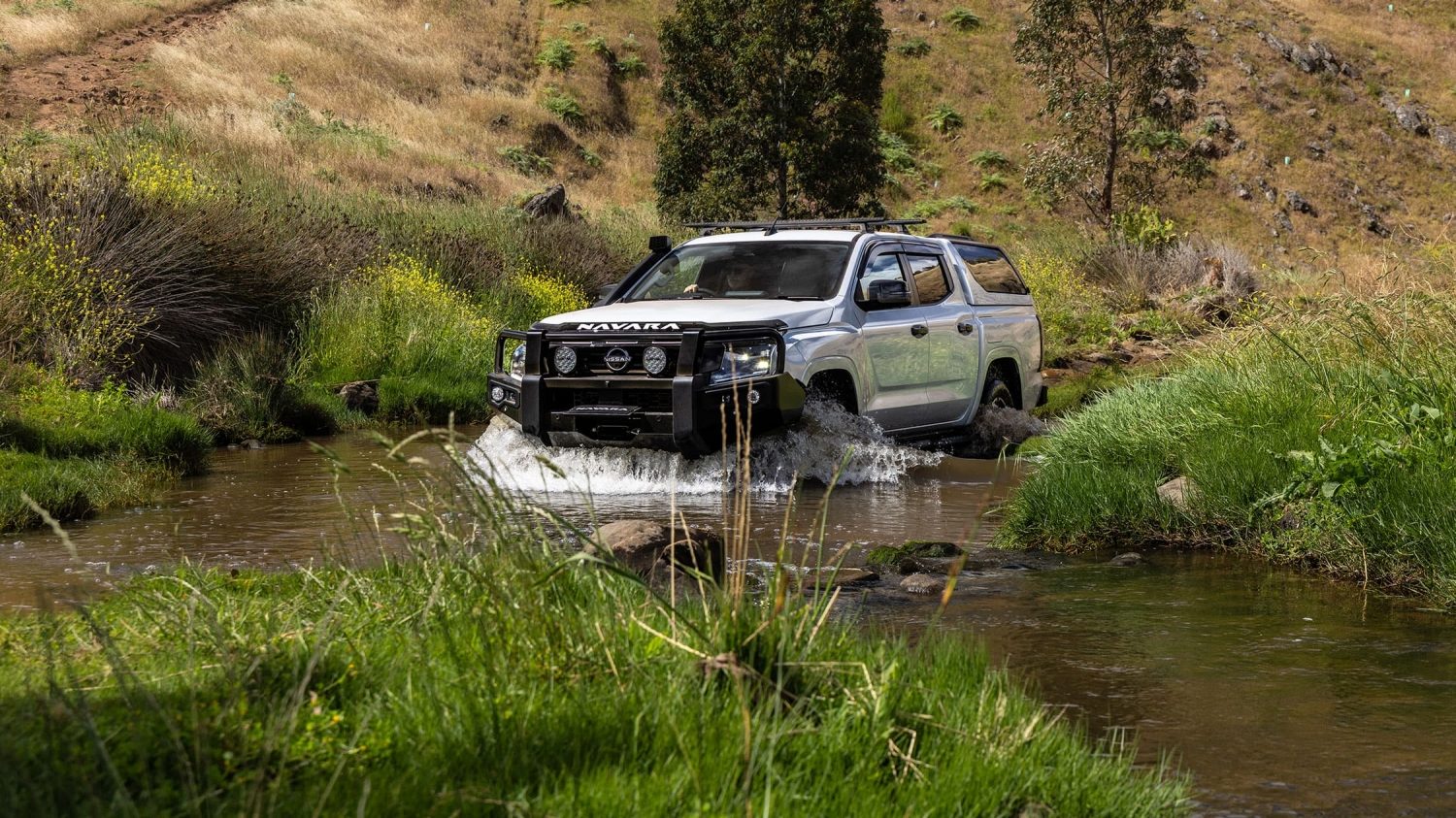 Accessorised Nissan Navara on rugged terrain