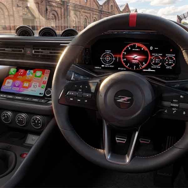 Close-up of steering wheel and infotainment system in Nissan Z Nismo
