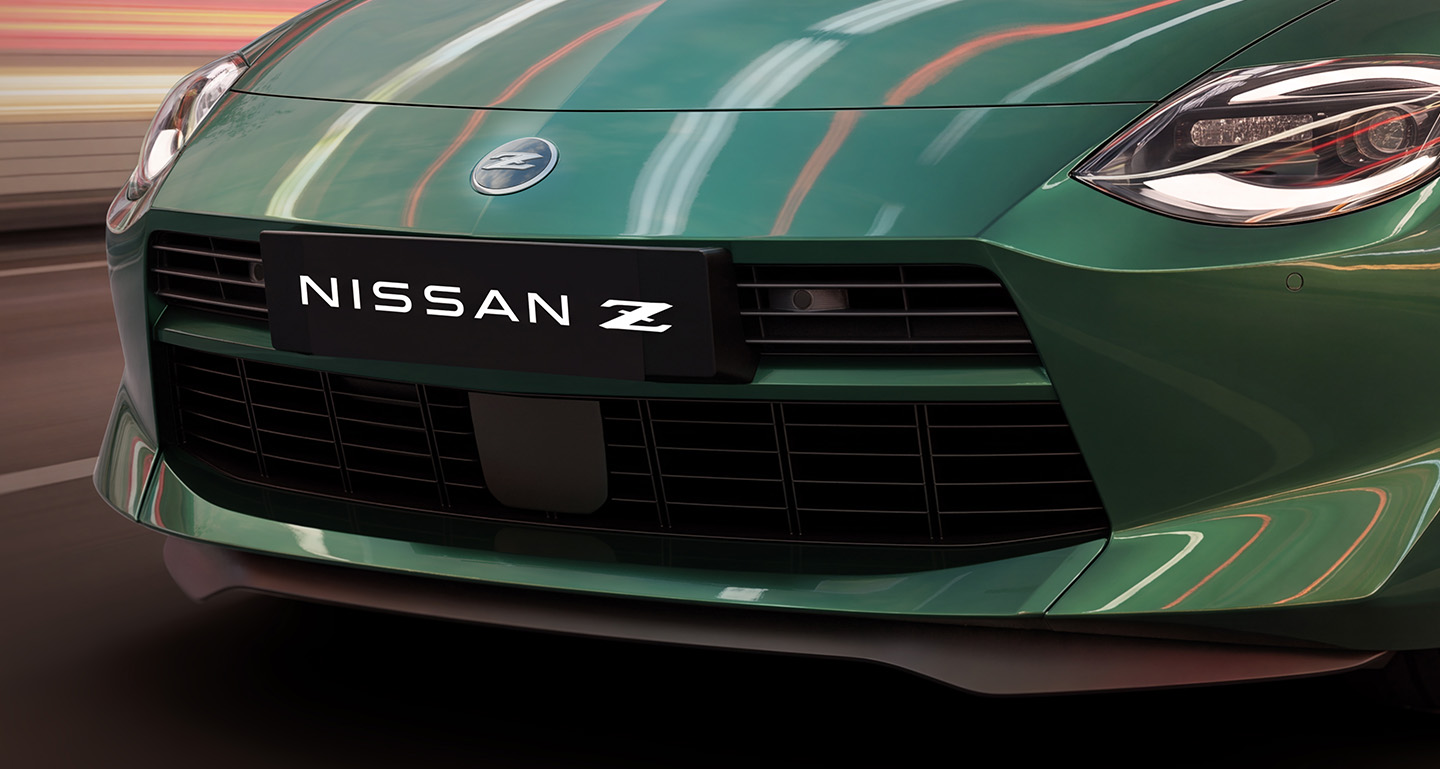 Nissan Z Coupe driving through a tunnel with motion-blurred light trails