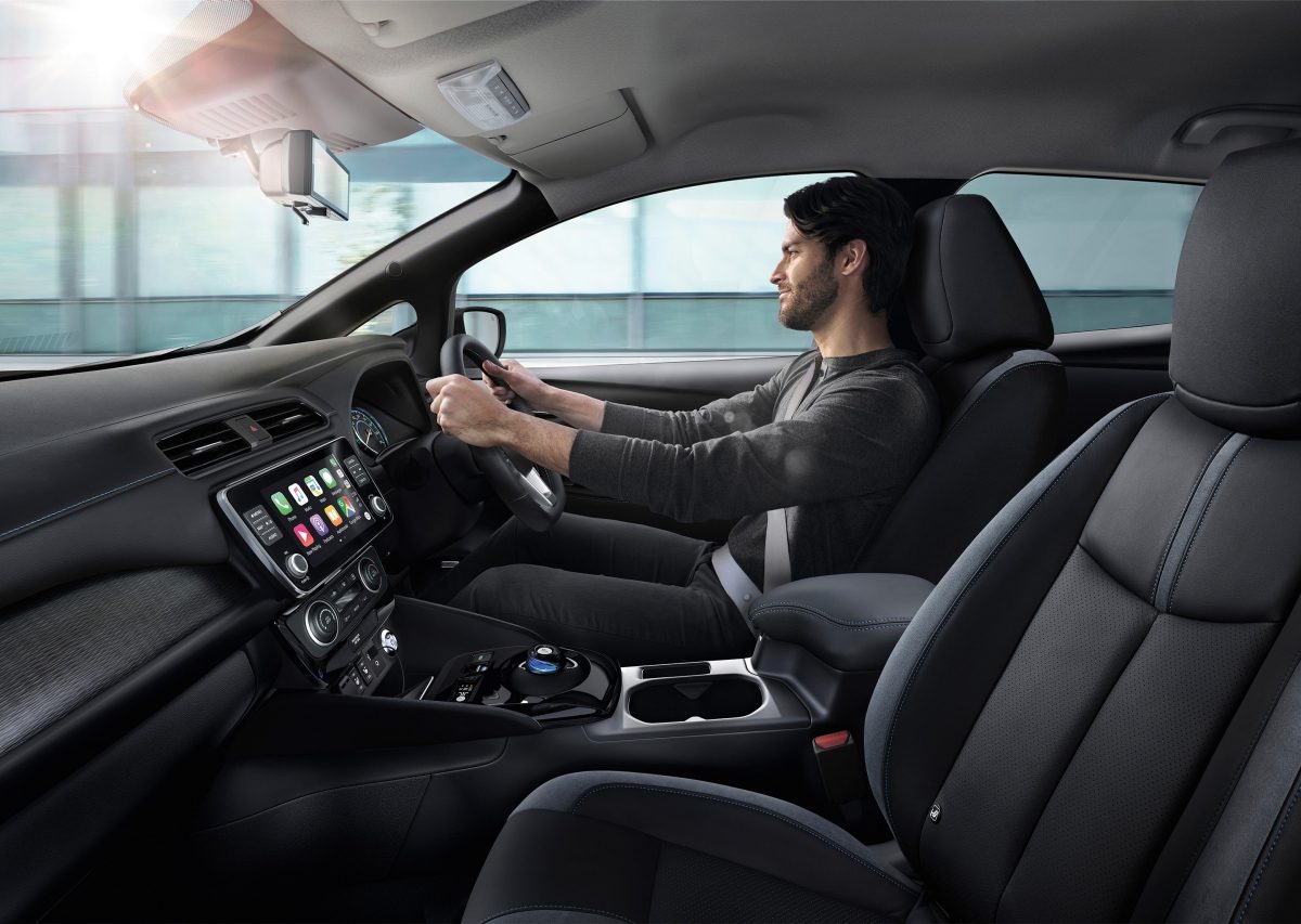 Man driving a Nissan LEAF