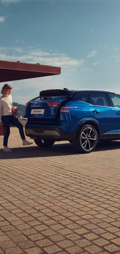 Nissan ARIYA on a curved mountain road at night