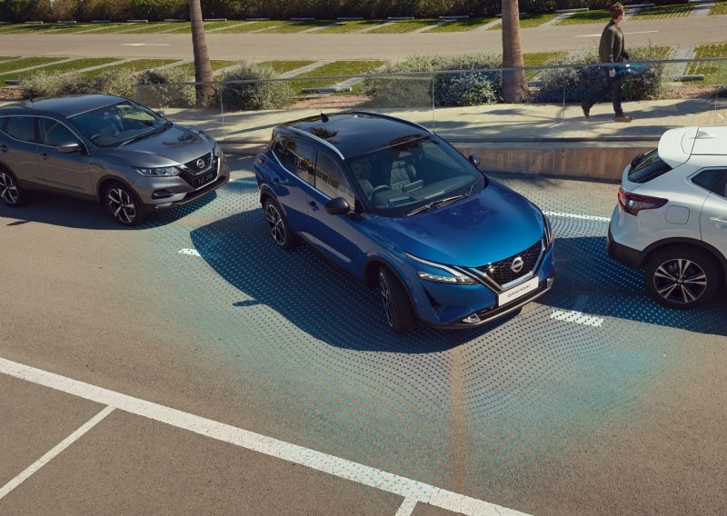 Nissan ARIYA on a curved mountain road at night