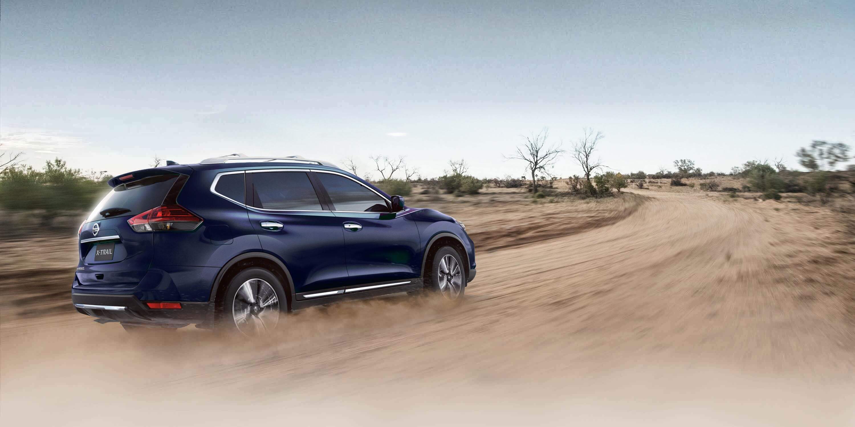 x-trail driving on dirt road