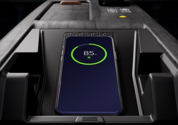 Nissan ARIYA showing smartphone on wireless charging pad