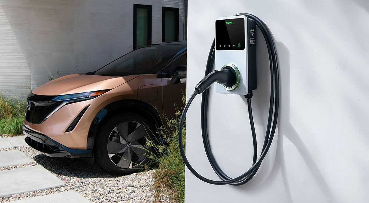 Nissan ARIYA charging at home in carport