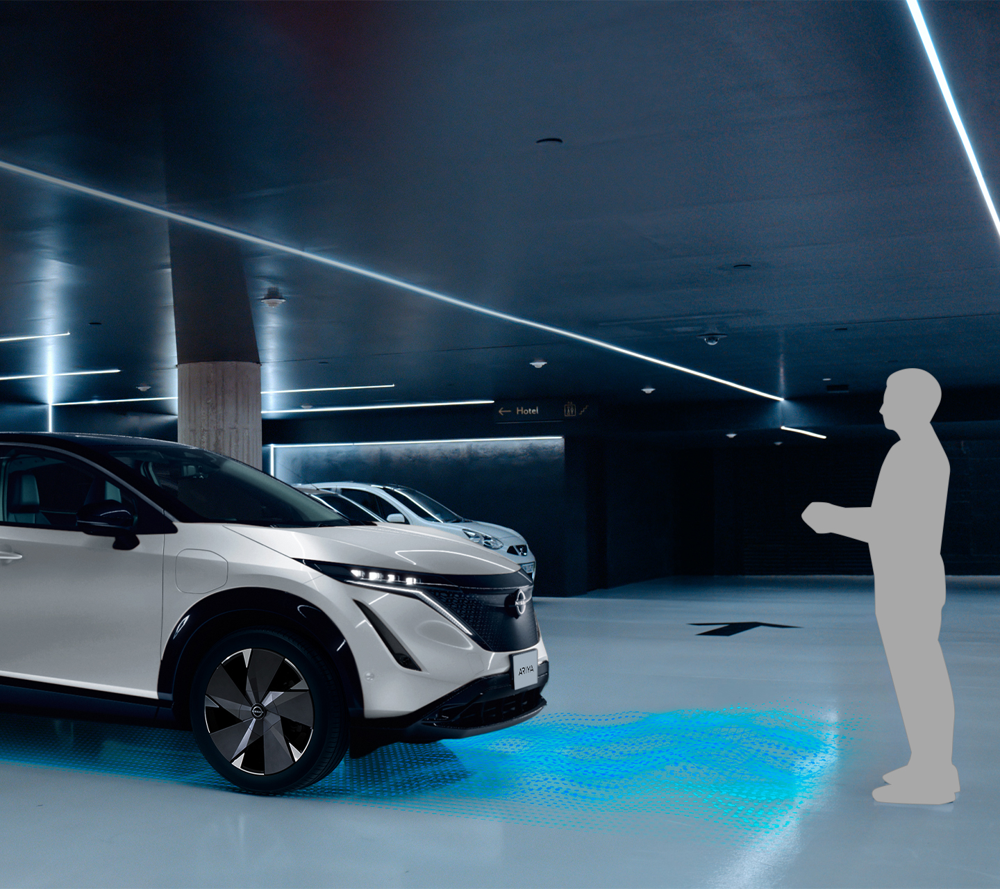 Nissan ARIYA in a car park using ProPILOT Remote Park to back into a space