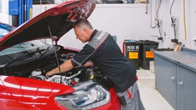 Nissan technician servicing a car