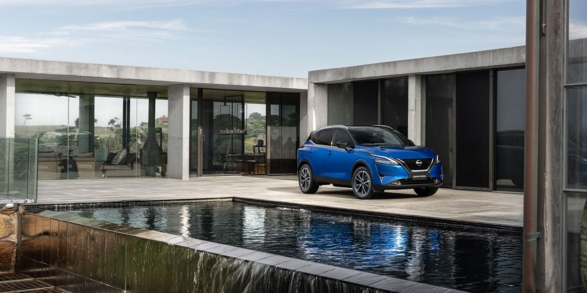 Nissan ARIYA on a curved mountain road at night